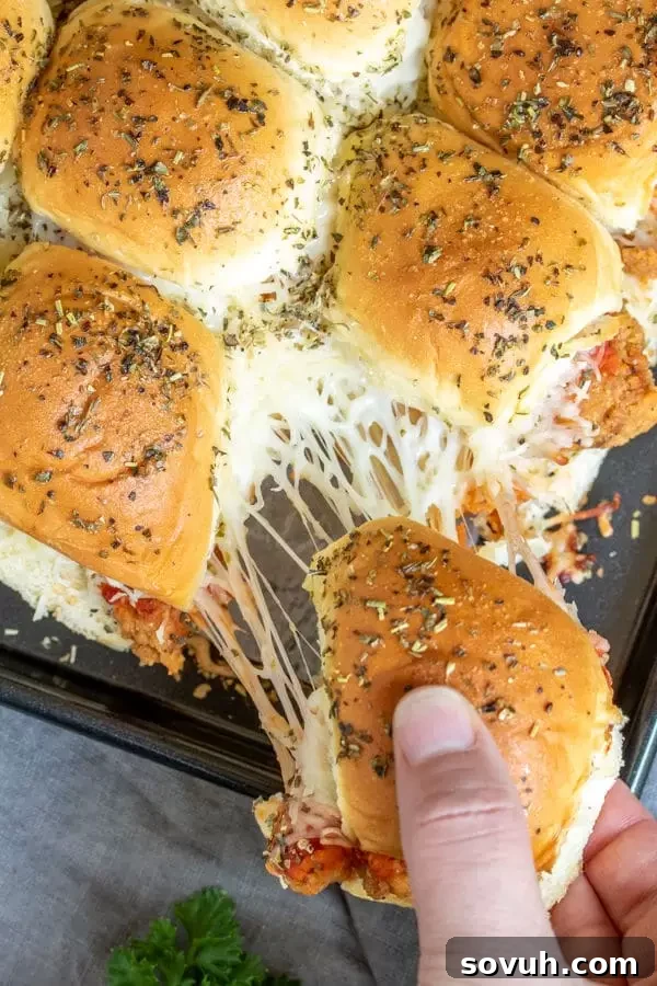 Crispy Chicken Parm Sliders 4 Golden-baked Chicken Parmesan Sliders topped with Italian seasoning, ready to serve