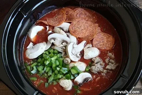 Customizing Slow Cooker Pizza Soup with your favorite toppings like mushrooms, bell peppers, sausage, and pepperoni.