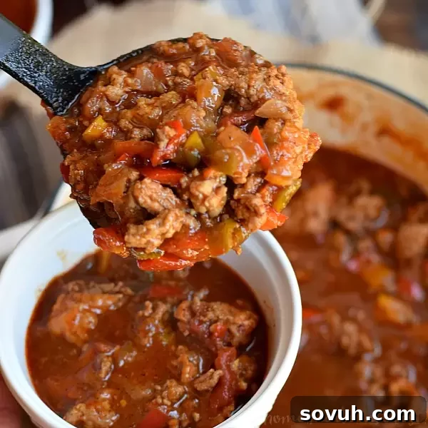 Hearty Pale Ale Beer Chili, perfect for game day gatherings. This easy stove-top chili, made with ground beef, ground pork, and robust pale ale, promises rich flavor for football season.