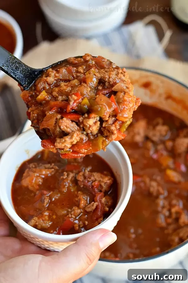 Pale Ale Beer Chili, a flavorful and hearty game day meal. Cooked on the stove top, not in a crock pot, this easy recipe is perfect for football season. Featuring craft beer, it's a hit for any party.