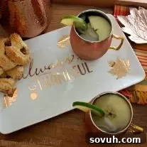 A vibrant Apple Cider Moscow Mule, ideal for festive fall occasions and holiday parties. Quick and easy to make!