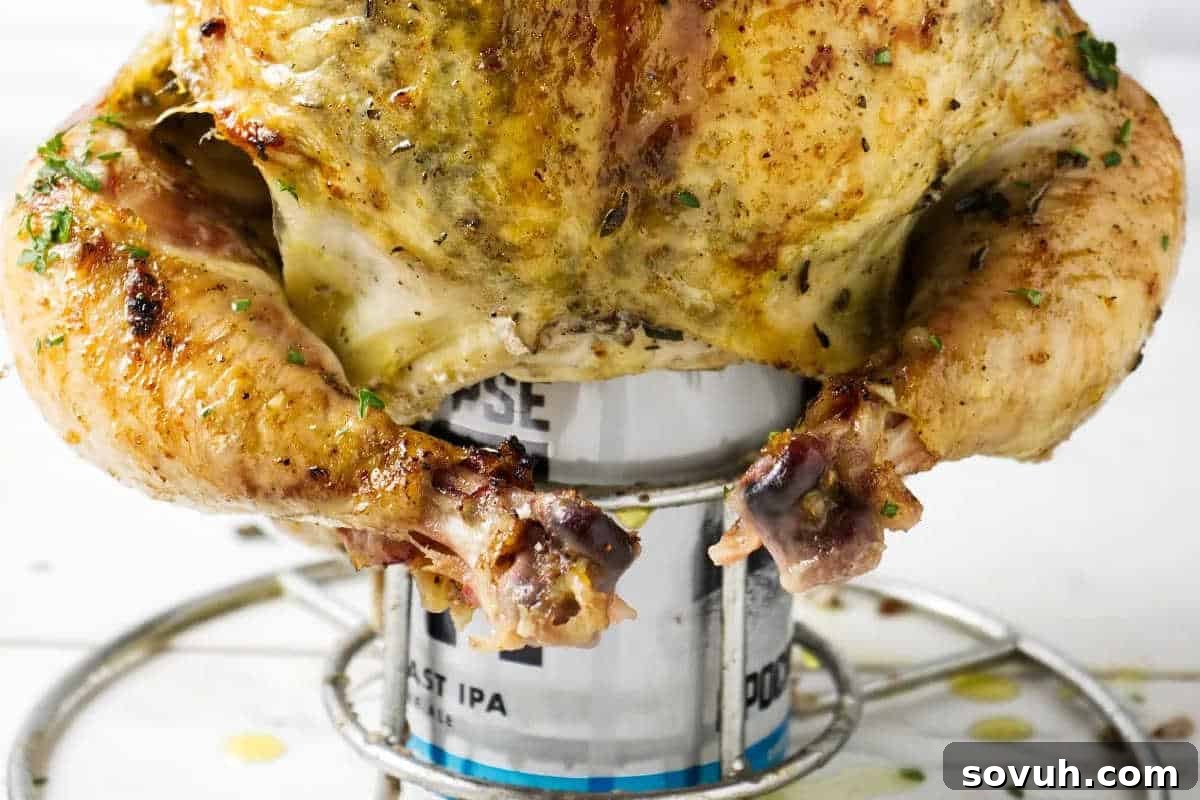 A perfectly smoked whole beer can chicken, sitting upright on a can, seasoned with a fragrant herb garlic butter rub, boasting crispy golden skin and garnished with fresh parsley, ready to be carved.