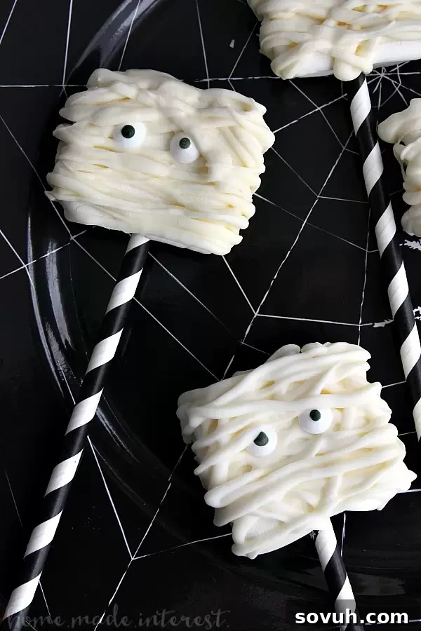 Phantom Puffs 5 Finished Mummy Marshmallows displayed vertically, showcasing spooky and adorable Halloween treats.