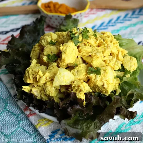 A vibrant close-up of Turmeric Chicken Salad, showcasing its creamy texture and rich golden color. This easy, healthy, and low-carb recipe is perfect for make-ahead lunches or dinners, offering a delicious way to enjoy antioxidant-rich turmeric.