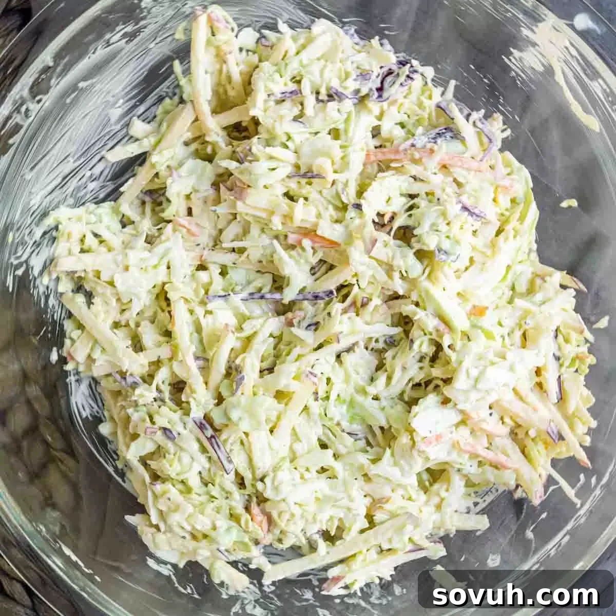 Apple coleslaw mixture in glass bowl
