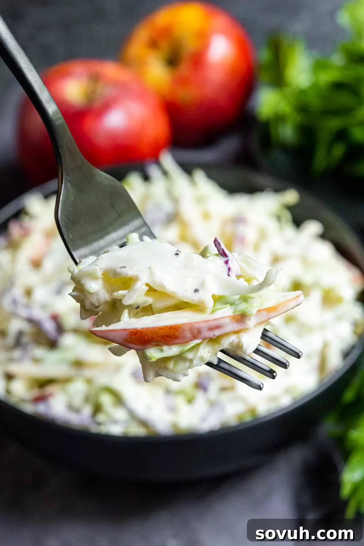 Apple coleslaw on a fork