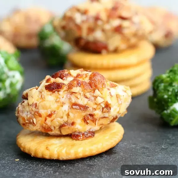 An inviting platter of Game Day Bacon Cheese Balls, perfectly golden and ready to be devoured, with crackers scattered around for serving.