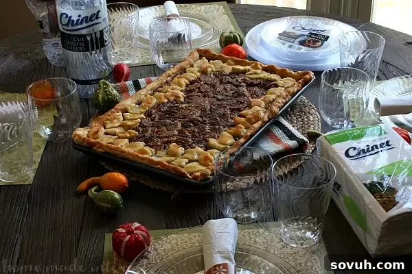 An elegant holiday table setting featuring Pecan Slab Pie, enhanced by Chinet® Cut Crystal® tableware, showcasing effortless entertaining.