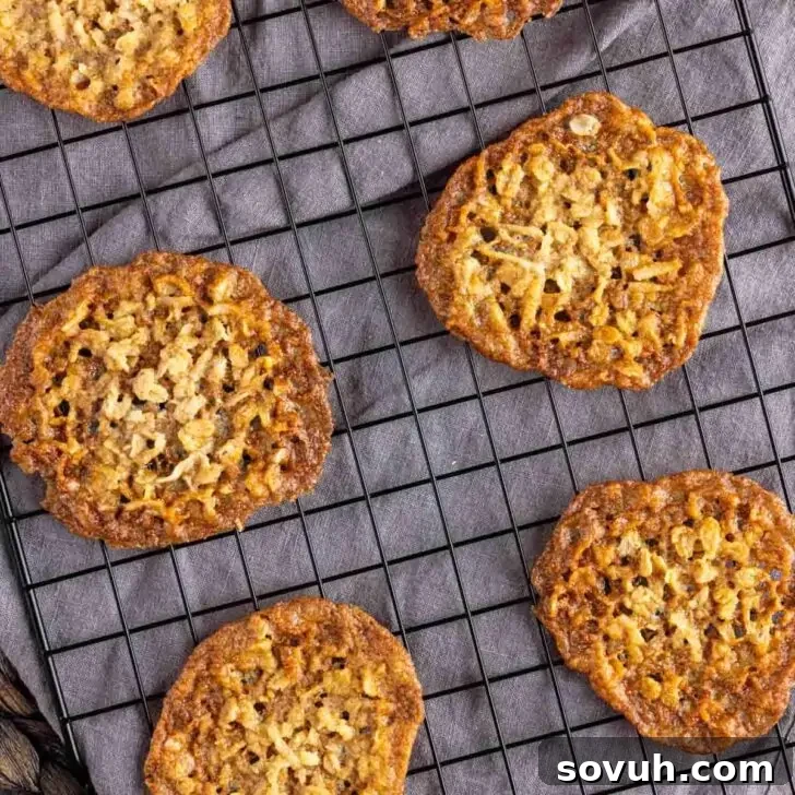 Crispy Coconut Cookies on a cooling rack.