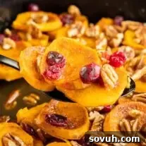 Cranberry Sweet Potato Casserole on a serving spoon