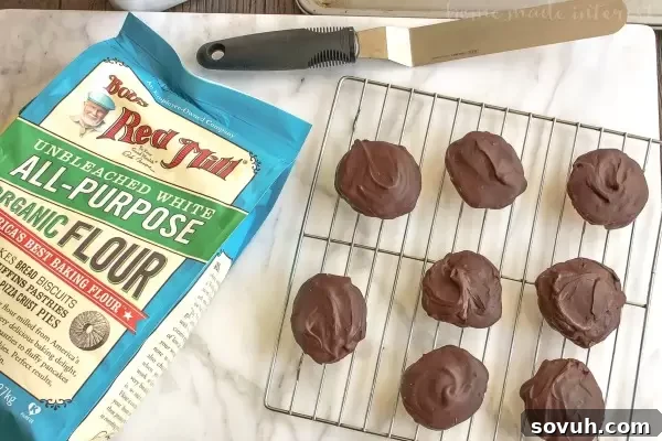 A tray of freshly baked Berger Cookies with their signature thick, fudge frosting drying. These Maryland favorites make excellent holiday gifts or Christmas cookies.
