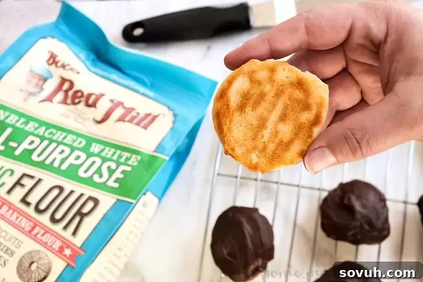 The soft, cake-like base of a Berger Cookie, ready for its generous layer of rich fudge frosting.