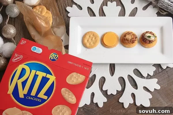 Mini Crab Cake Bites on RITZ Crackers with cheddar cheese, ready for a festive holiday party
