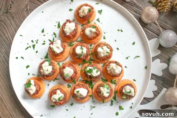 Christmas tree shaped platter of Mini Crab Cake Bites garnished with parsley for holiday display