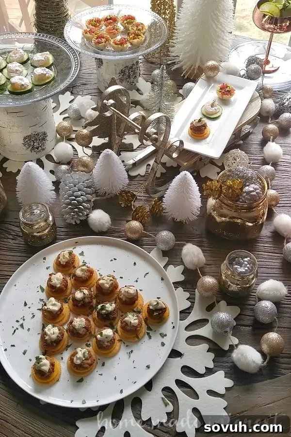 Vertical shot of an elegant holiday table spread with Mini Crab Cake Bites and other seafood appetizers, metallic decorations