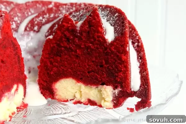 Get ready for Valentine’s Day with this Red Velvet Bundt Cake with cream cheese filling. It is a beautiful and easy Valentine’s Day dessert recipe filled with cream cheese and topped with a cream cheese glaze. It is an amazing red velvet cake recipe for Valentine’s Day!