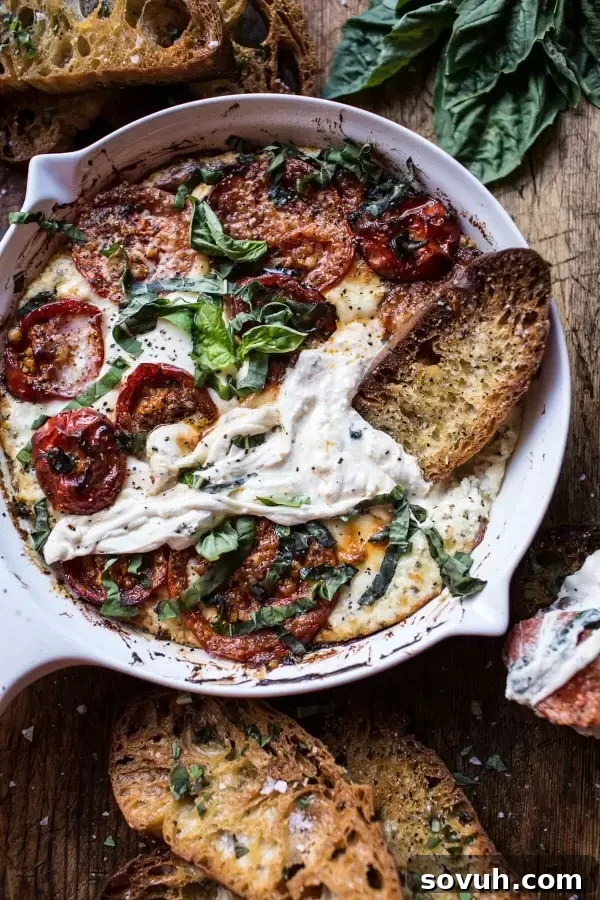 A bubbling Margherita Pizza Dip, a fantastic cheesy appetizer for any football party.