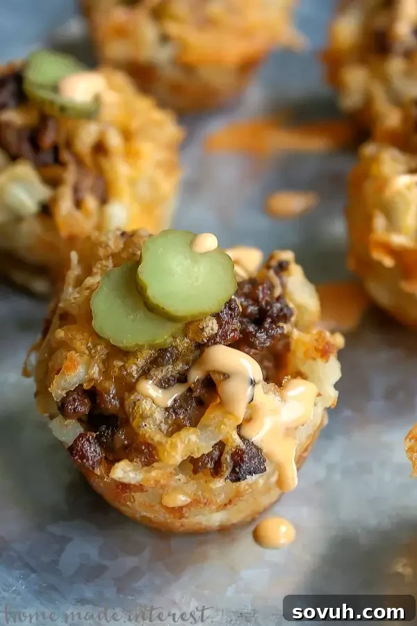 Loaded Cheeseburger Fries served in a red basket, a perfect and easy football party appetizer.