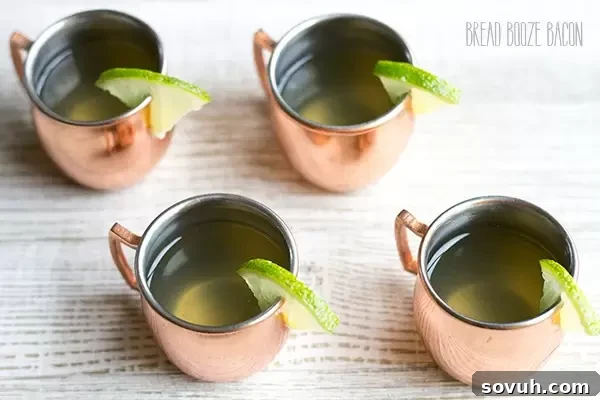 Close-up of sparkling Moscow Mule Jello Shots, showcasing their refreshing ginger and lime essence.