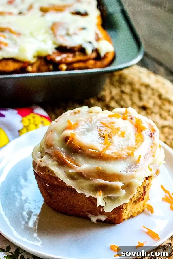 Unfrosted Carrot Cake Cinnamon Rolls baked to golden perfection, ready for frosting.