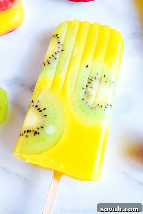 All natural mango popsicle with kiwi slices