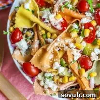Mexican Pasta Salad, a vibrant and easy summer side dish with multi-colored pasta and bold southwest flavors, perfect for Cinco de Mayo, BBQs, and picnics.