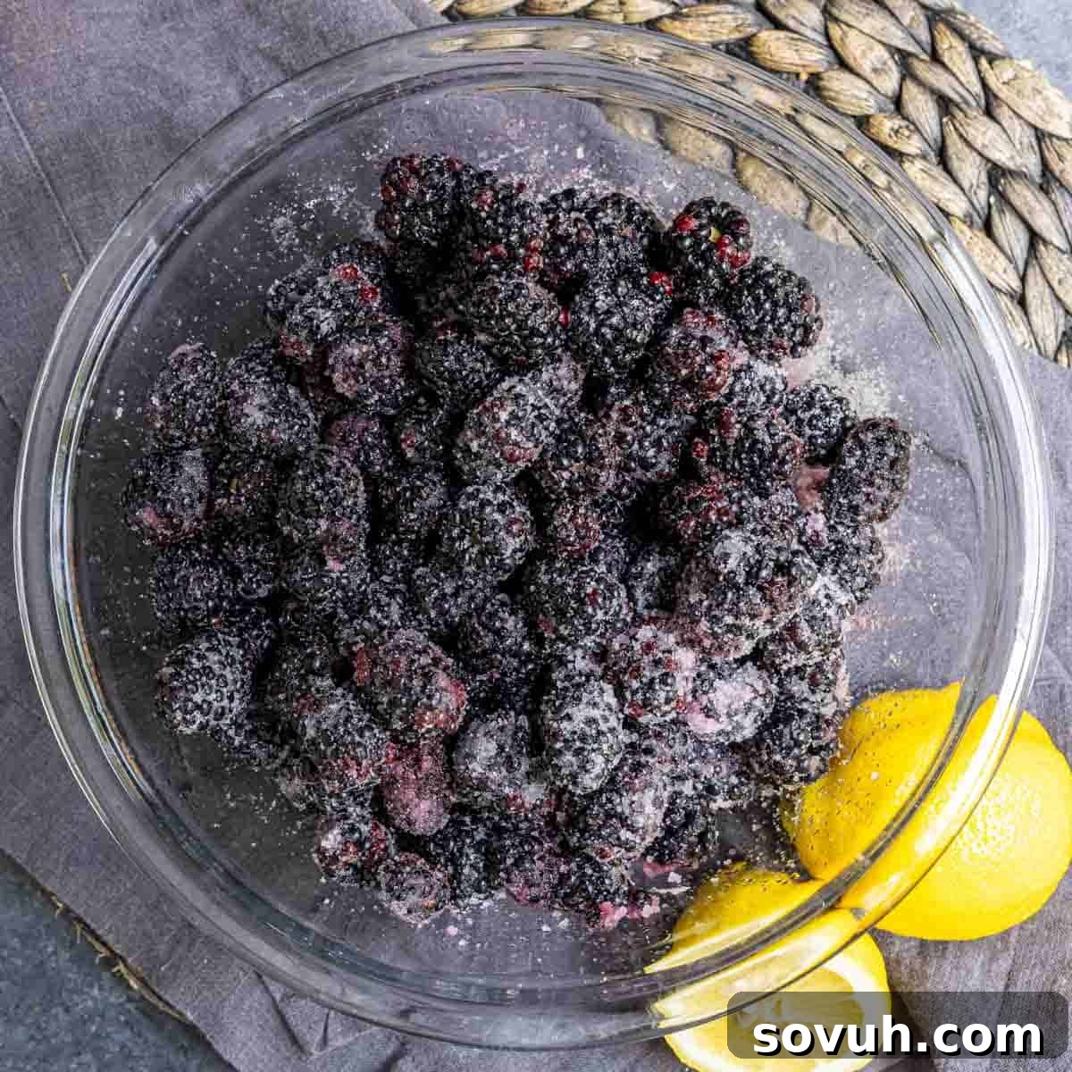 sugared blackberrys in glass bowl to make easy blackberry cobbler