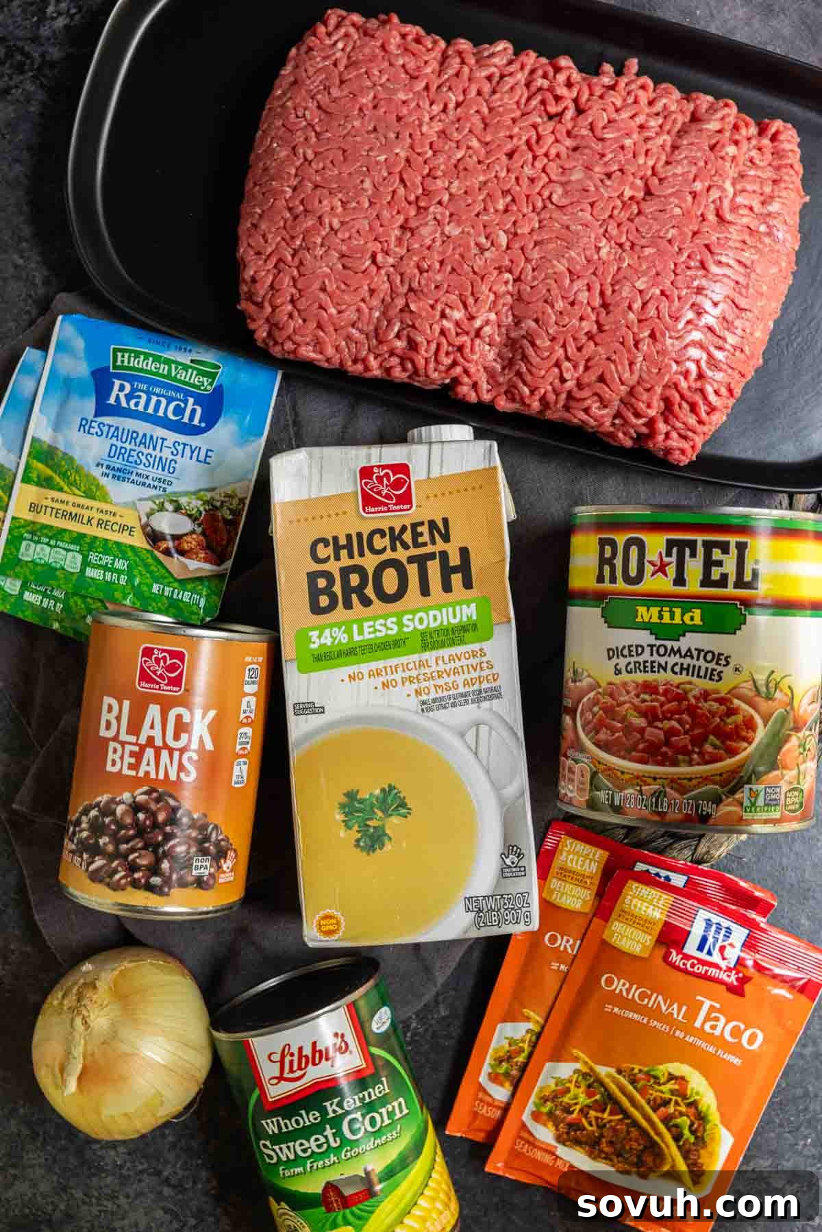 All the fresh and canned ingredients meticulously laid out for making delicious Instant Pot Taco Soup, including ground beef, diced tomatoes with chiles, black beans, corn, and essential seasonings.