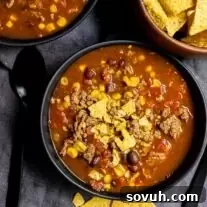 Instant Pot Taco Soup with corn tortillas and tortilla chips.