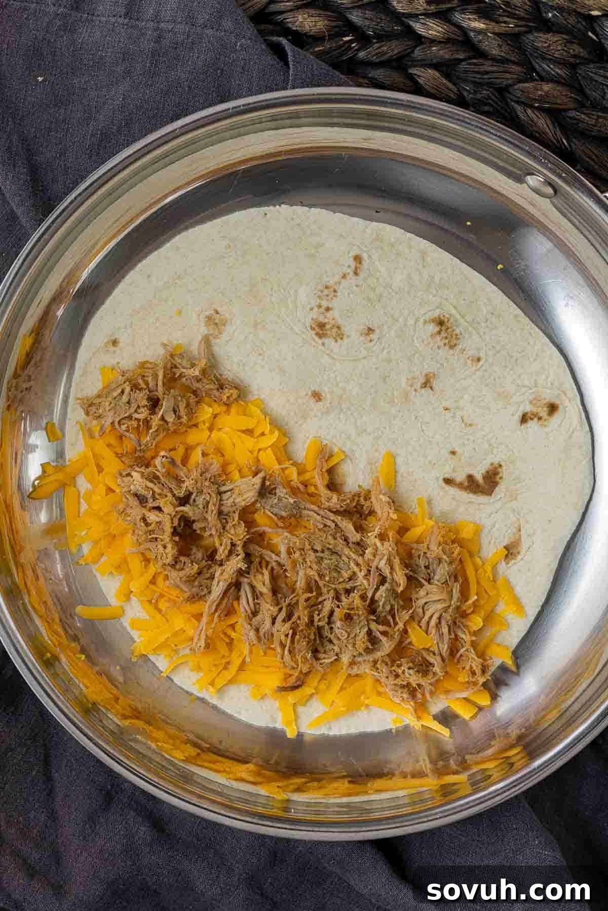 Step-by-step process of assembling a Pulled Pork Quesadilla, showing ingredients being added to a tortilla in a skillet.