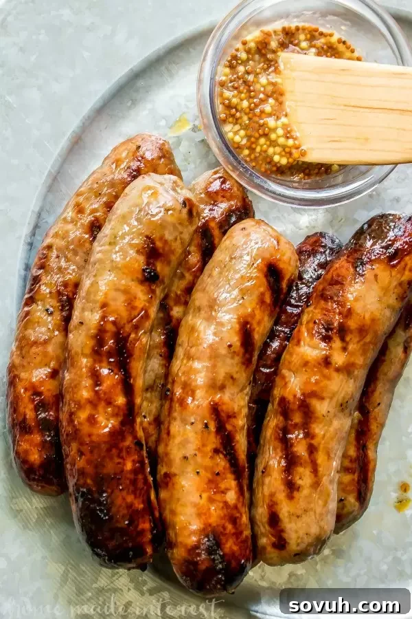A platter of perfectly grilled Smithfield Yuengling Brats, ready to be assembled into delicious sliders.