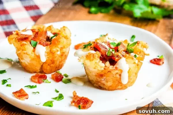 Finished Loaded Tater Tot Bites: Easy game day appetizer, perfect for football parties, filled with bacon, cheese, and sour cream. Best potato appetizer!