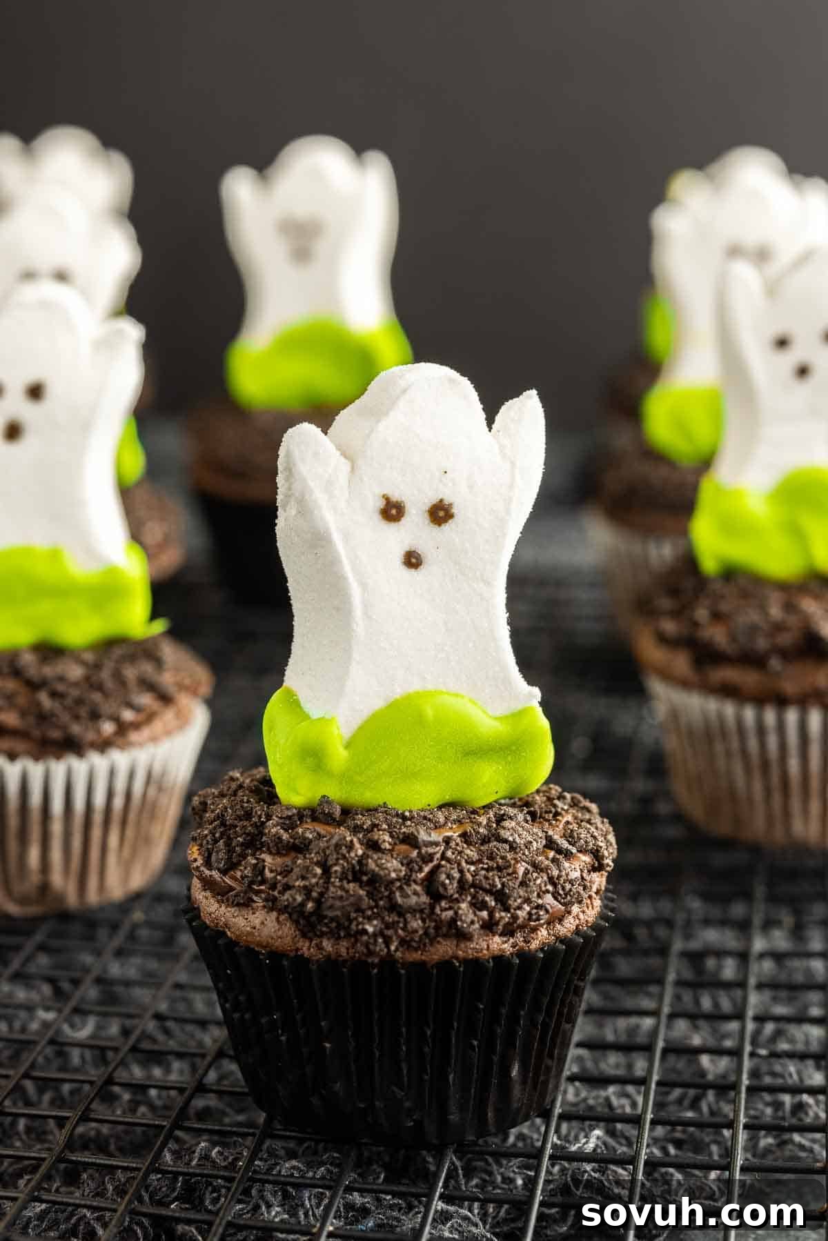 Finished Ghost Goo Halloween Cupcakes cooling on a wire rack