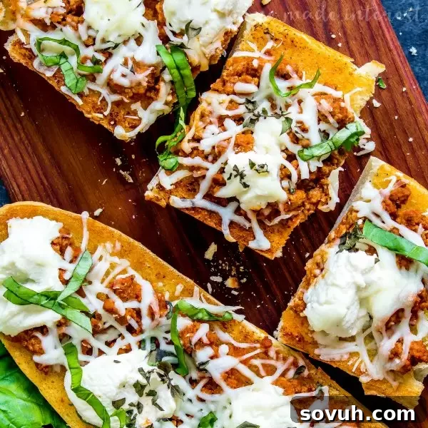 Lasagna French Bread Melts 2 top view of close up of lasagna french bread pizza slice