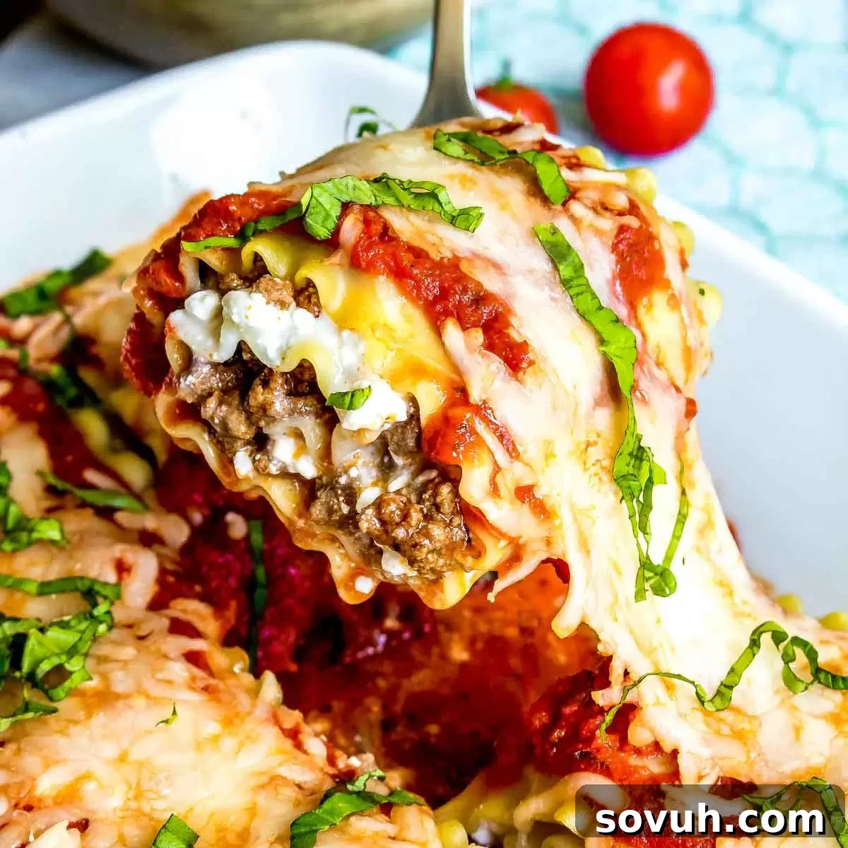 Serving Lasagna Roll Ups garnished with fresh basil