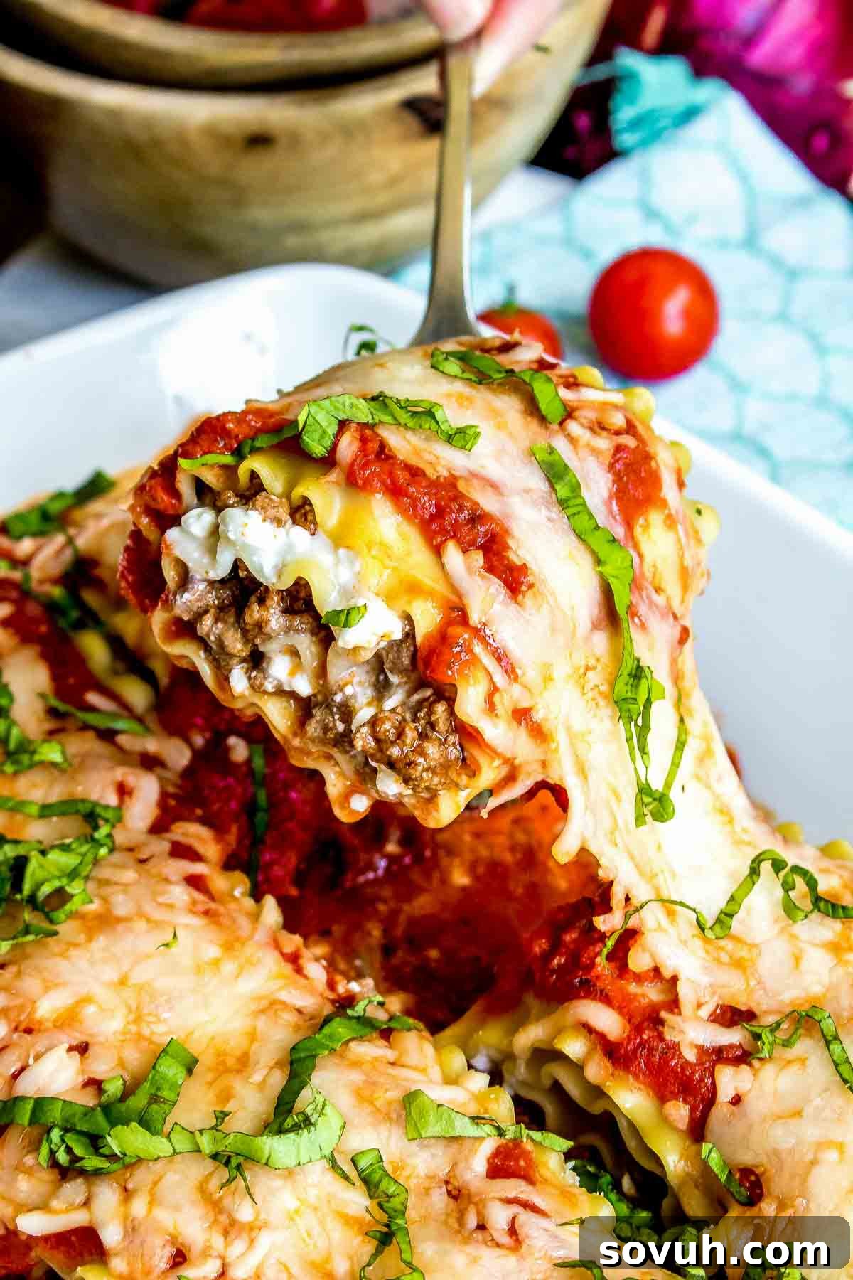 Baked Lasagna Roll Ups in a casserole dish, ready to serve