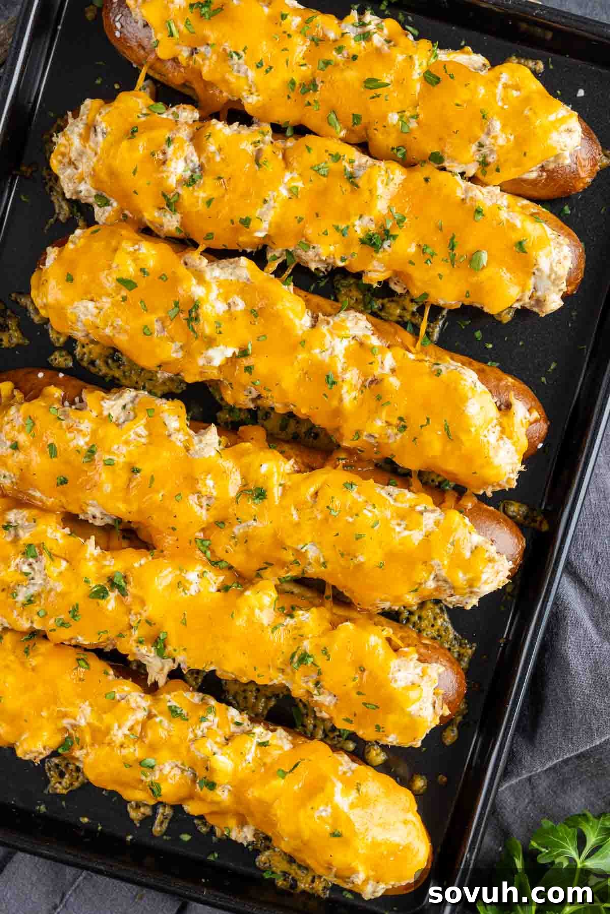 A tray of Crab Pretzel with cheese and herbs.