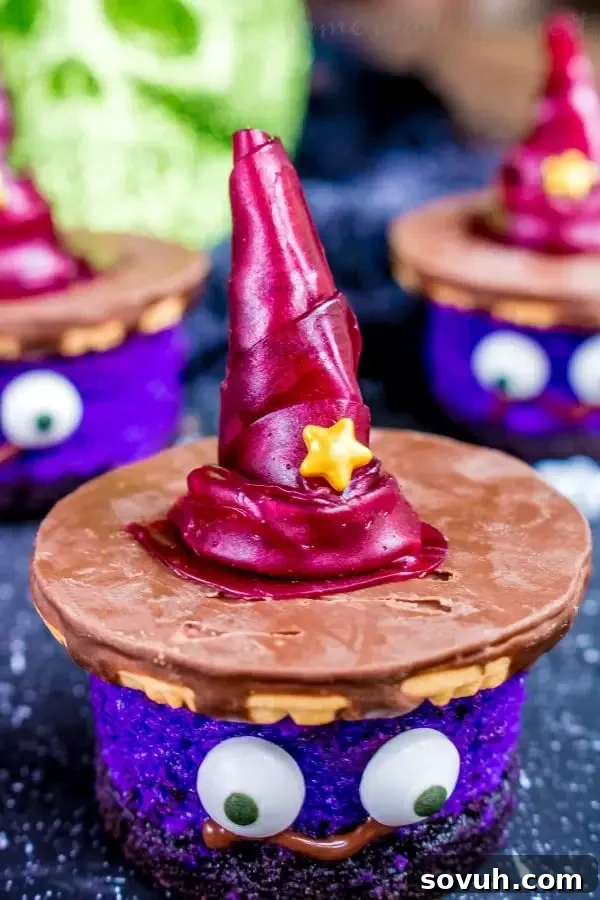 Close-up of a completed mini witch cheesecake with an edible hat