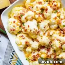 Baked Cauliflower with Cheese Casserole topped with bacon and scallions