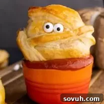 Halloween Baked Cheese mummy in sauce