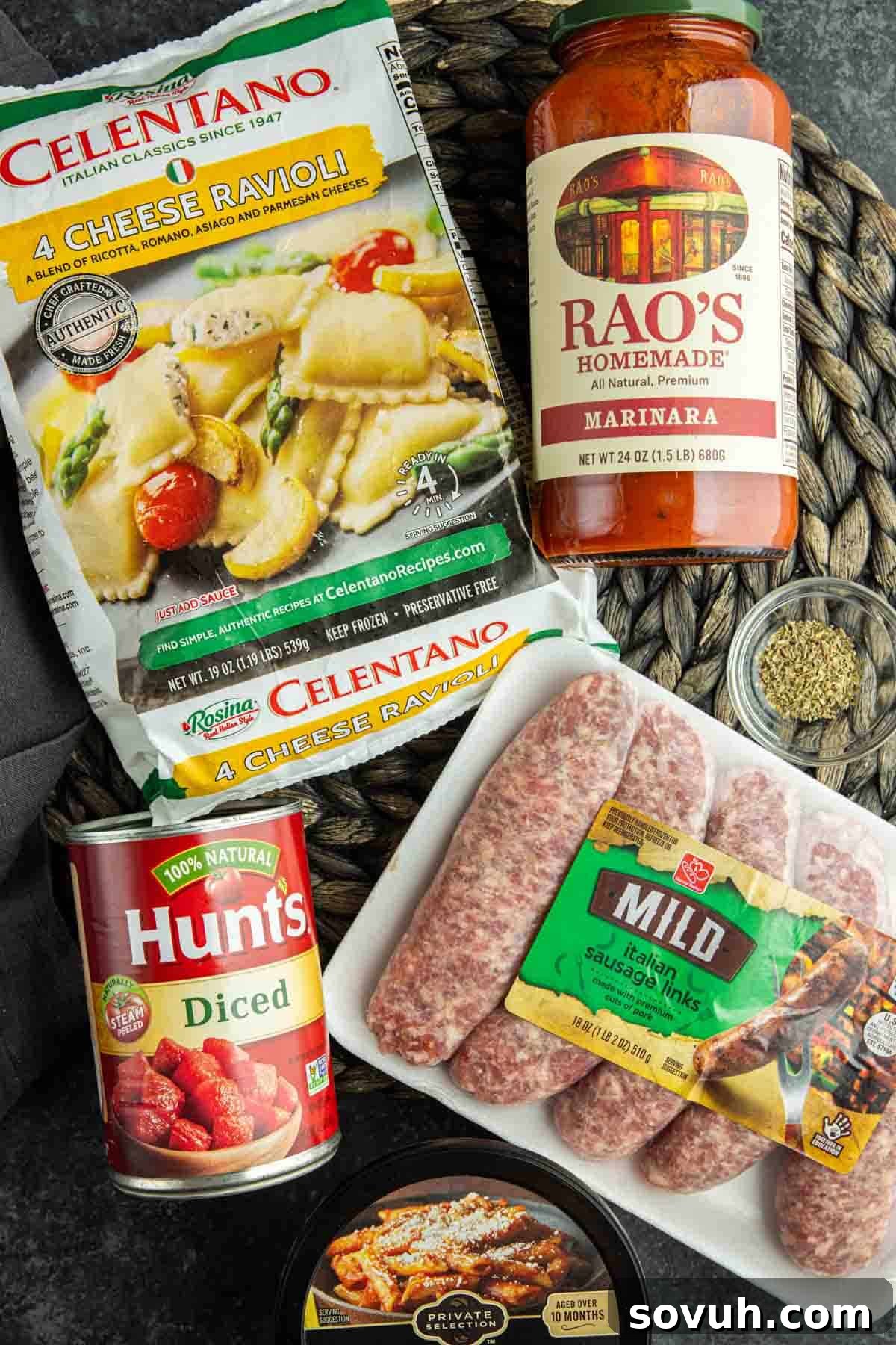 Essential ingredients for a delicious sausage casserole in the slow cooker: sausage, ravioli, pasta sauce, diced tomatoes, and Italian seasoning.