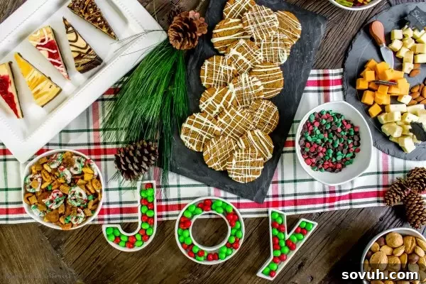 Festive Christmas table spread with gingersnap cookies, cheesecake, and cheese platter.