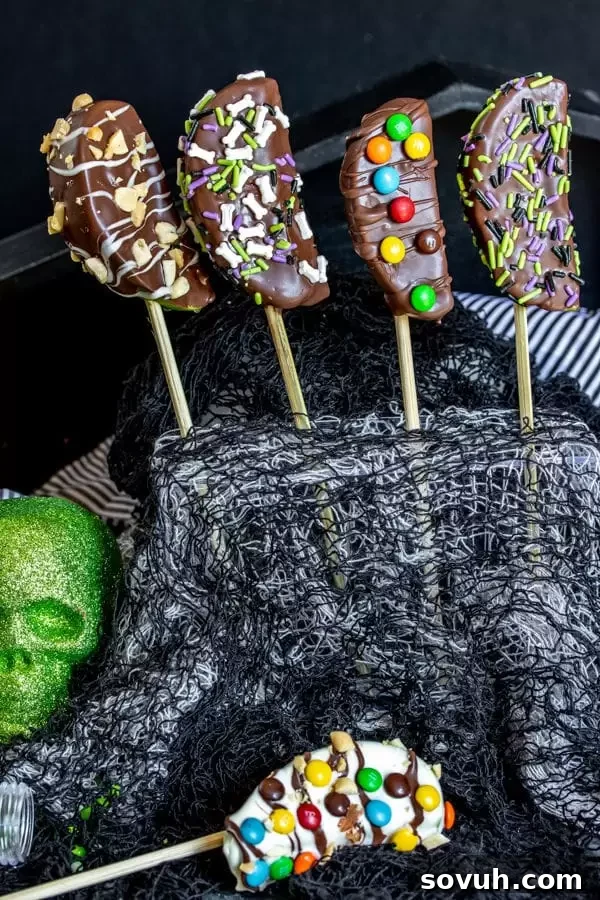 Halloween Chocolate Covered Apple Kabobs topped with nuts and sprinkles, ready to serve