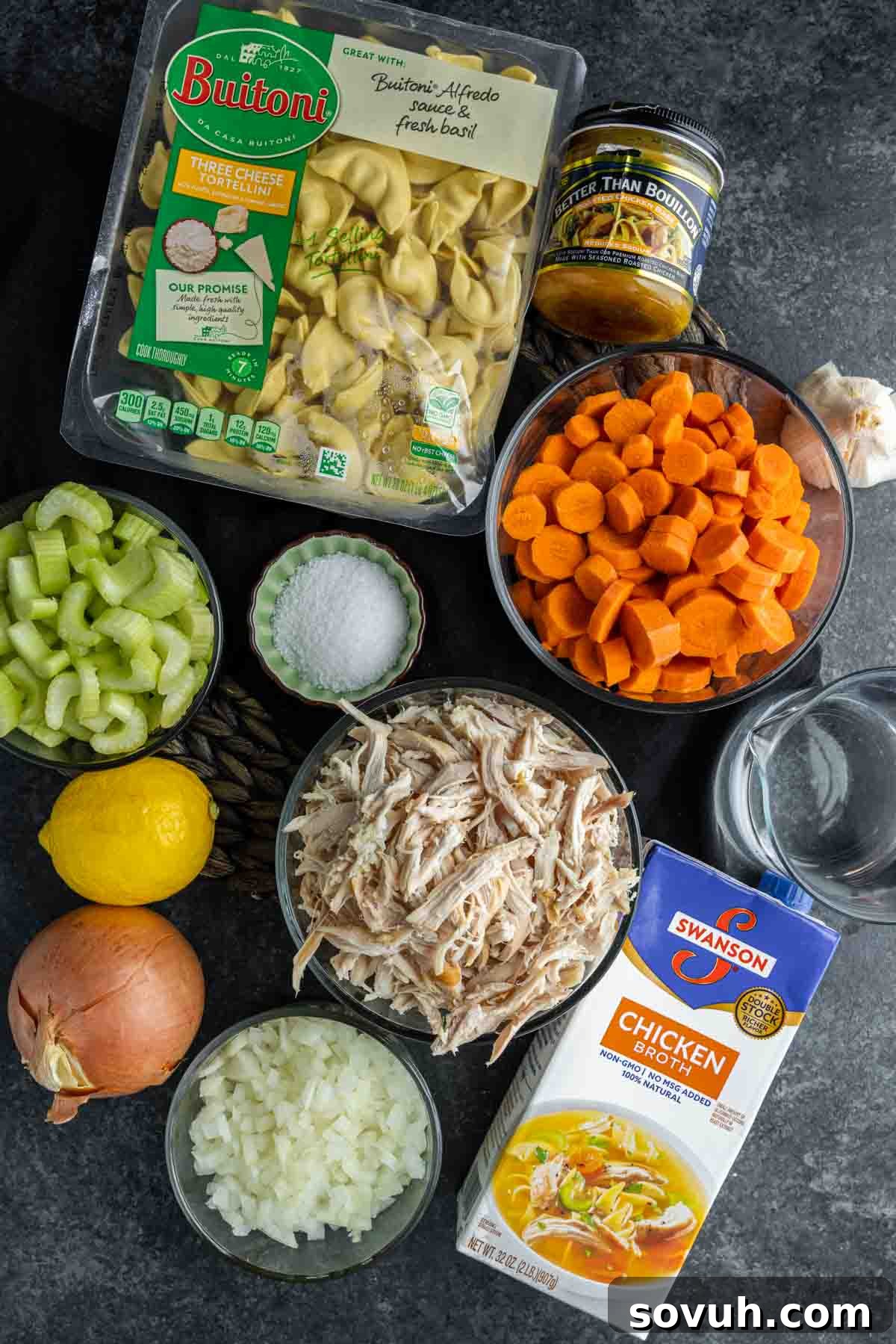 Ingredients for Rotisserie Chicken Tortellini Soup laid out on a kitchen counter