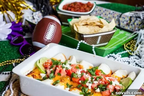 Game day table with beer braised beef enchiladas and chips