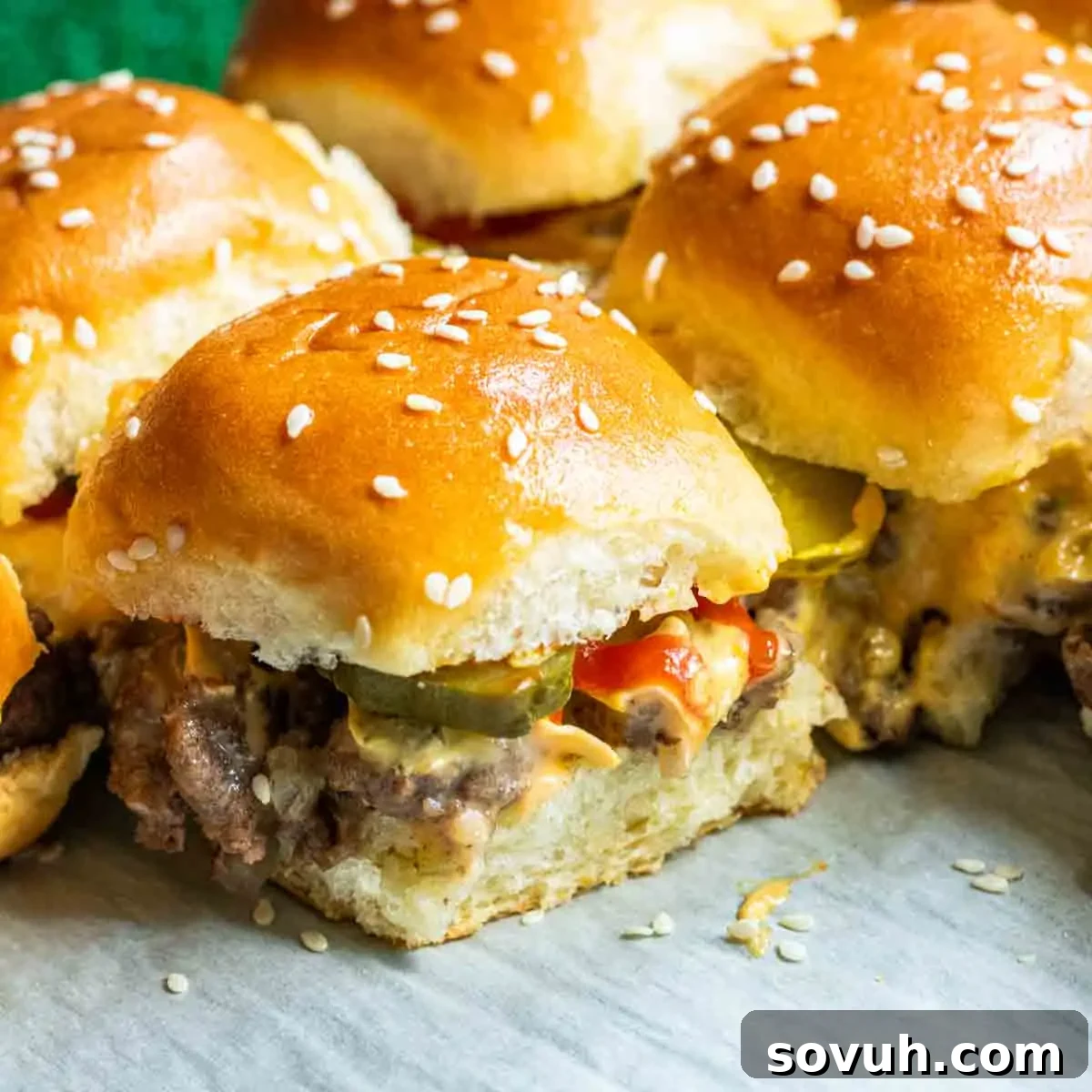 Homemade Big Mac Minis 2 Copycat Big Mac Sliders on a baking sheet, ready to serve.