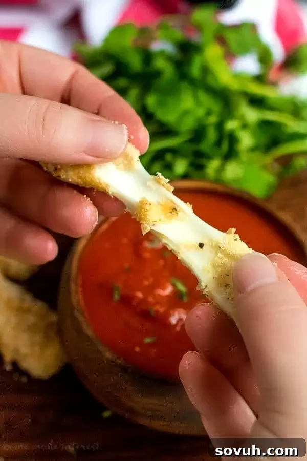 Deliciously cheesy low carb mozzarella sticks with a perfect pull