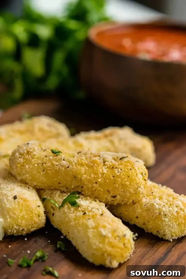 Easy Low Carb Mozzarella Sticks on a plate, ready to be enjoyed