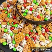 Black bowl filled with holiday Chex mix