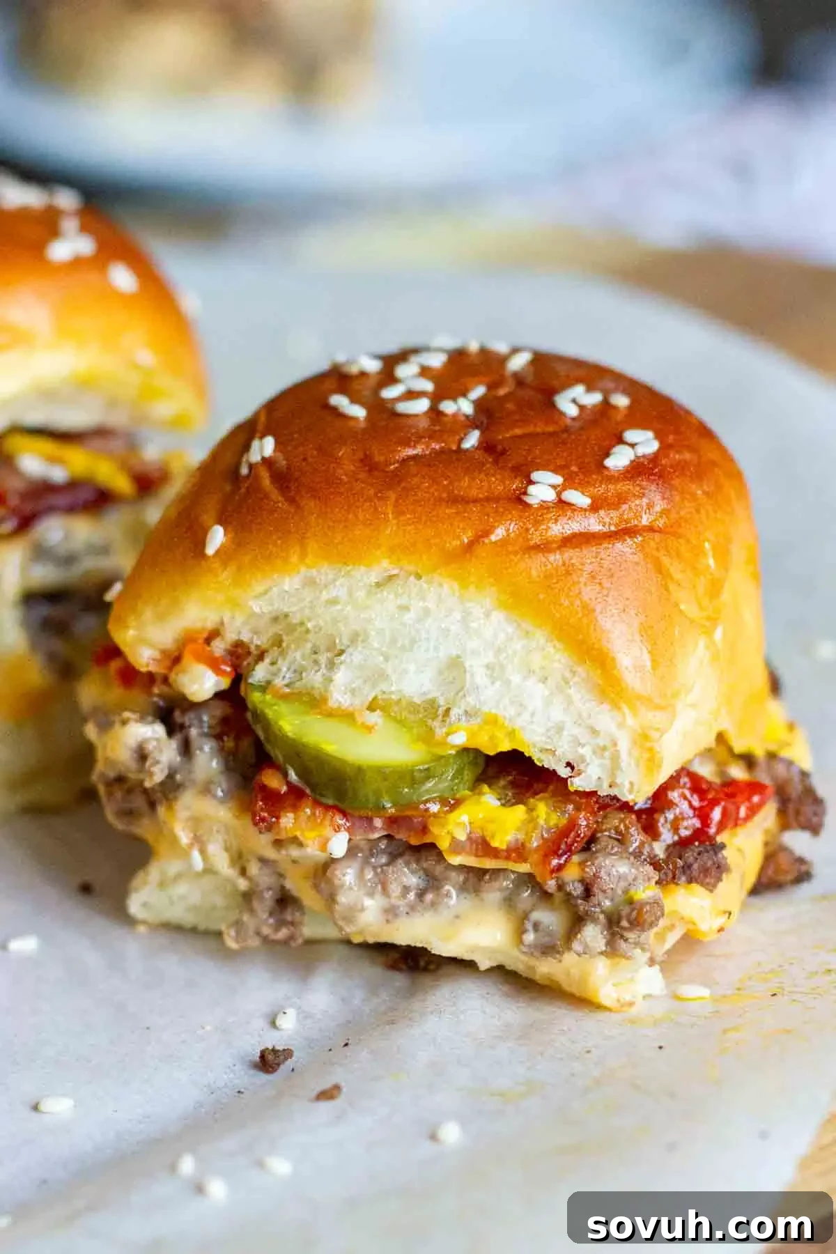 A tray of Bacon Cheeseburger Sliders made with soft Hawaiian rolls, baked to golden perfection